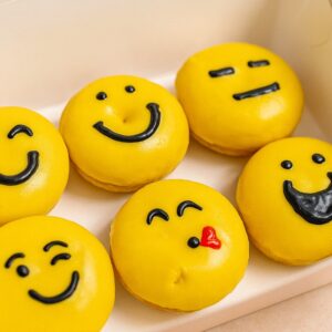 Custom themed smiley donuts in a gift box of six